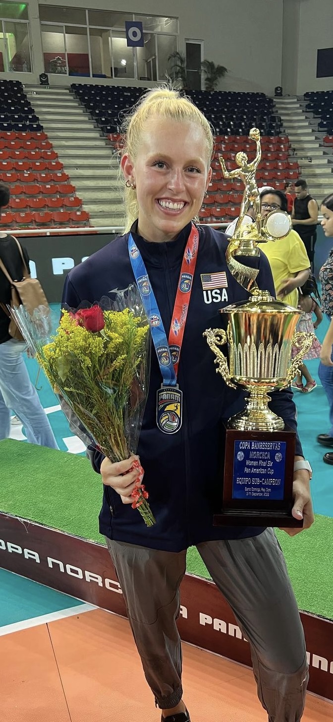 Alli Stumler holding USA Volleyball trophy